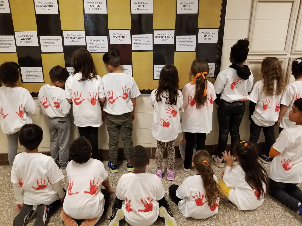 Mrs. Romero's Grade 1/2 class showing their "hands are for helping" activity in support of Orange Shirt Day!