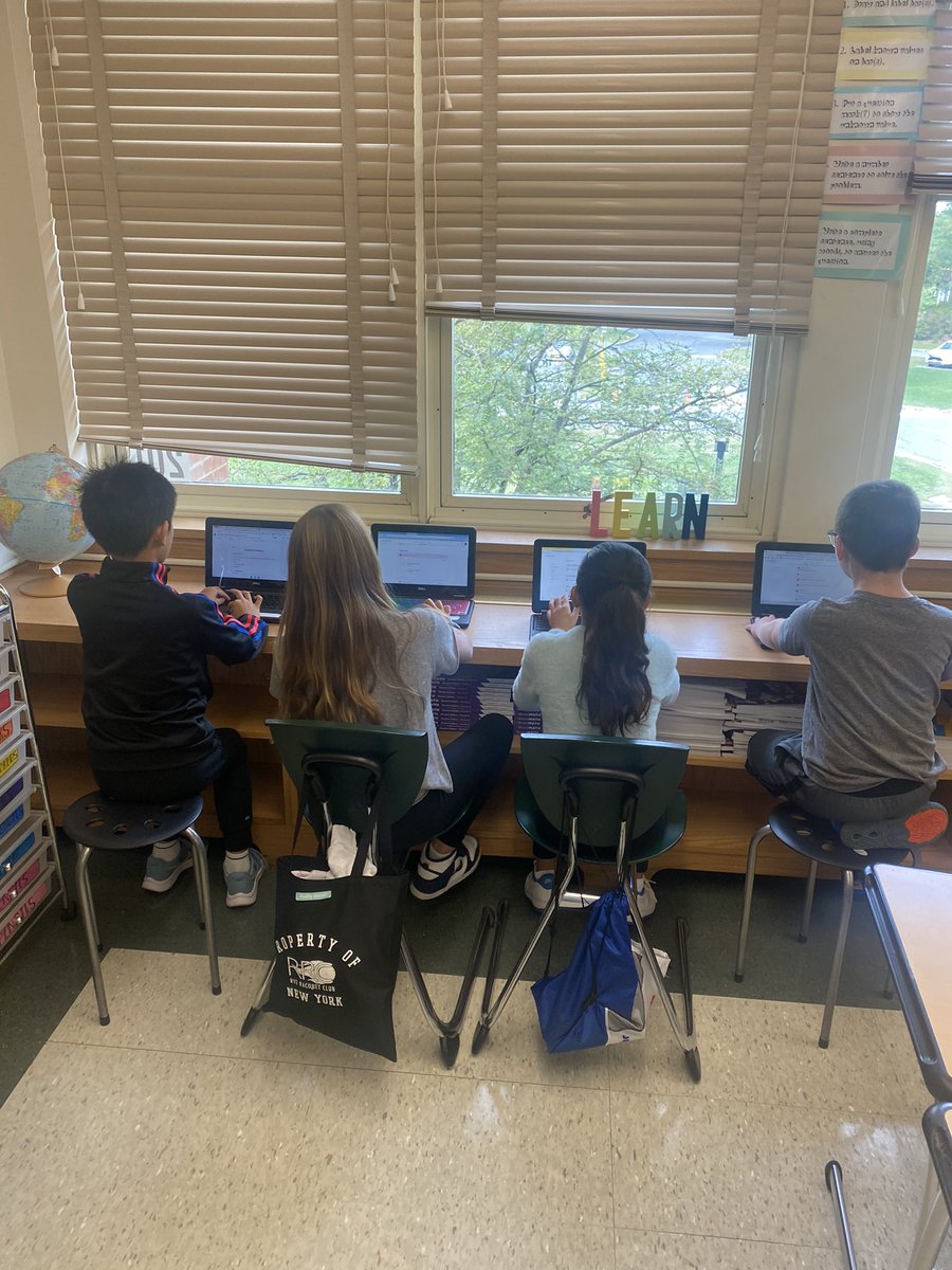 QRS_Marty's tweet photo. Reading groups working together to organize their ideas for their reading strategy posters! #qrspride https://t.co/1OkeUsLRSA