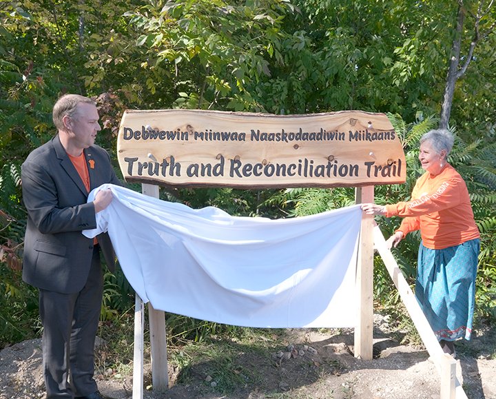 georgiancollege's tweet photo. Thanks to all who attended the unveiling of the new sign at our Truth and Reconciliation Trail in Orillia.🧡

The orange rocks symbolize the lives lost at Canada’s residential schools, and the trail is an all-season reminder of the ongoing journey toward Truth and Reconciliation. https://t.co/xw2IQdpxTO