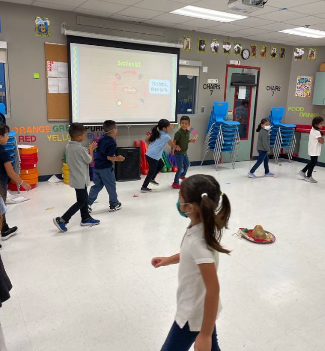 DeckerESMusic's tweet photo. We had fun doing @Quaver_Ed "El Jarabe Tapatio". We practiced counting to 15 and moving to the beat of the music as a group! Building their musical confidence one "beat" at a time! I love the looks of excitement and concentration on their faces @DeckerES @Manor_FA #scholarsfirst https://t.co/vneozADoeA