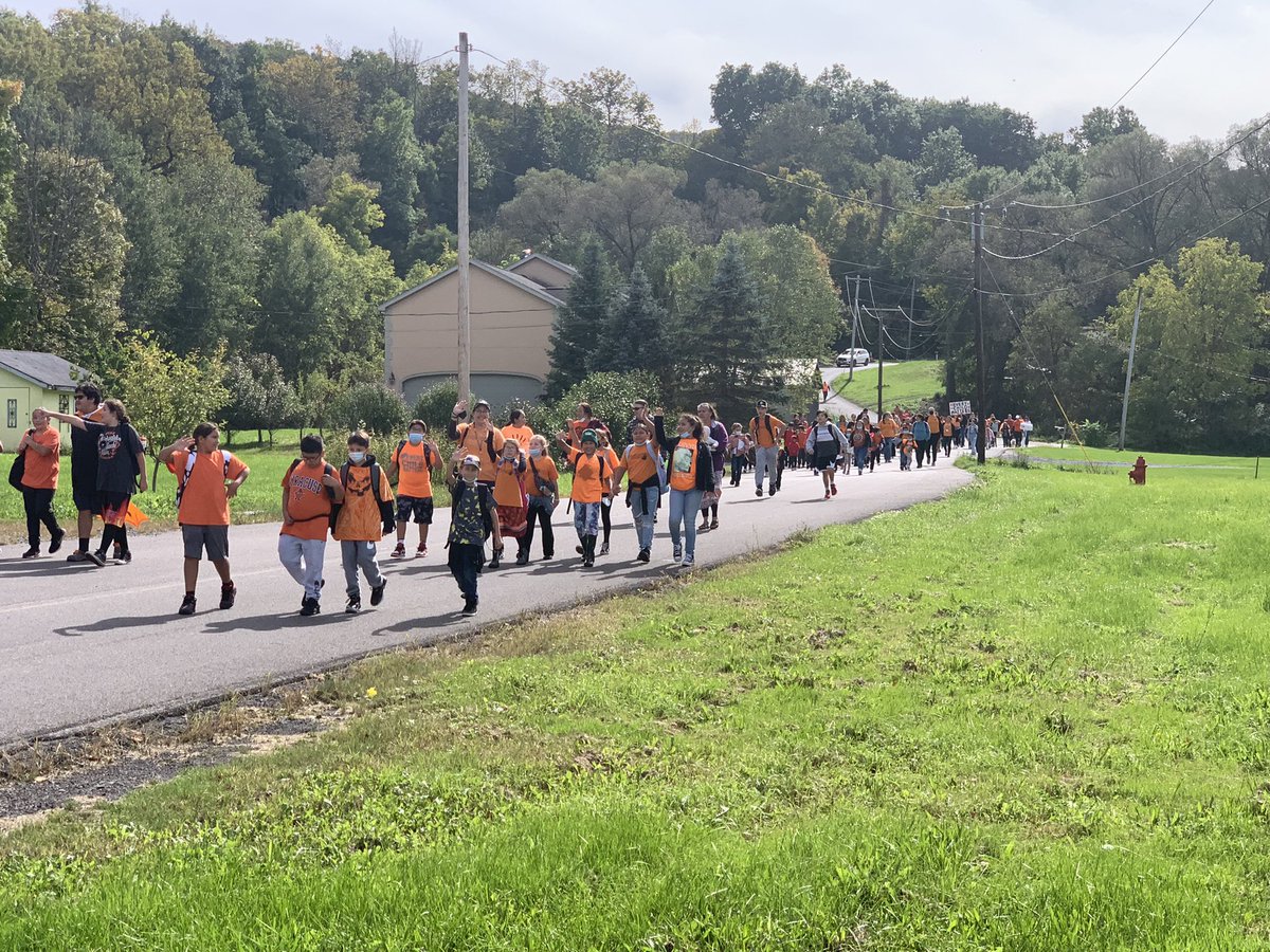 Onondaga Nation School walks to the Longhouse to dance for #OrangeShirtDay #TruthAndReconciliation #EveryChildMatters