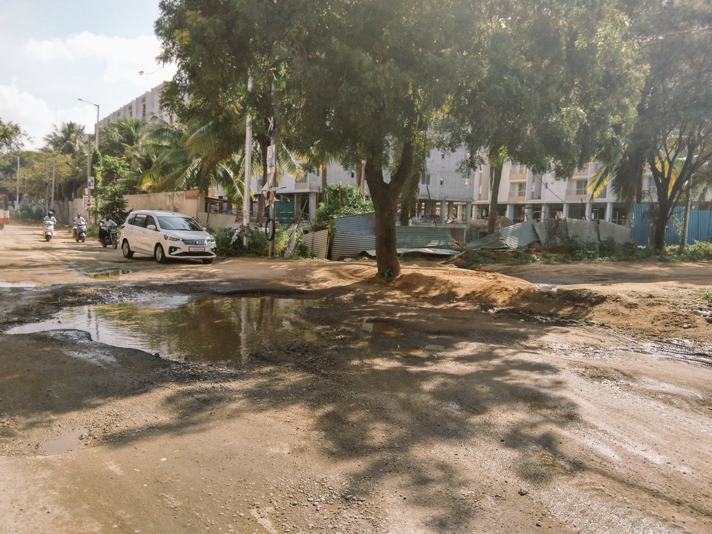 NewBolarum's tweet photo. @KTRTRS Garu #Pothole riddled #NewBolarum #Bolarum to #Turkapally mainroad via #RlyCly #ARKHomes #VBCity Public frustrated with medical/health,drainage&traffic issues,wit delays in even filling potholes it has become terrible.Full Patch work/new road needed urgently,frm5k+Homes🙏🏽 https://t.co/9kN2YGzkBi