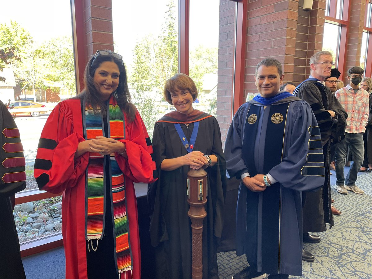 ProfAstrid's tweet photo. What a beautiful day for the installation of President Cruz Rivera at #nau ! Moving speeches and festive atmosphere. @RimaBrusi, Faculty Senate President Kate Ellis, and @NAUPresident lining up for the processional. https://t.co/5Z8v7SGq7Y
