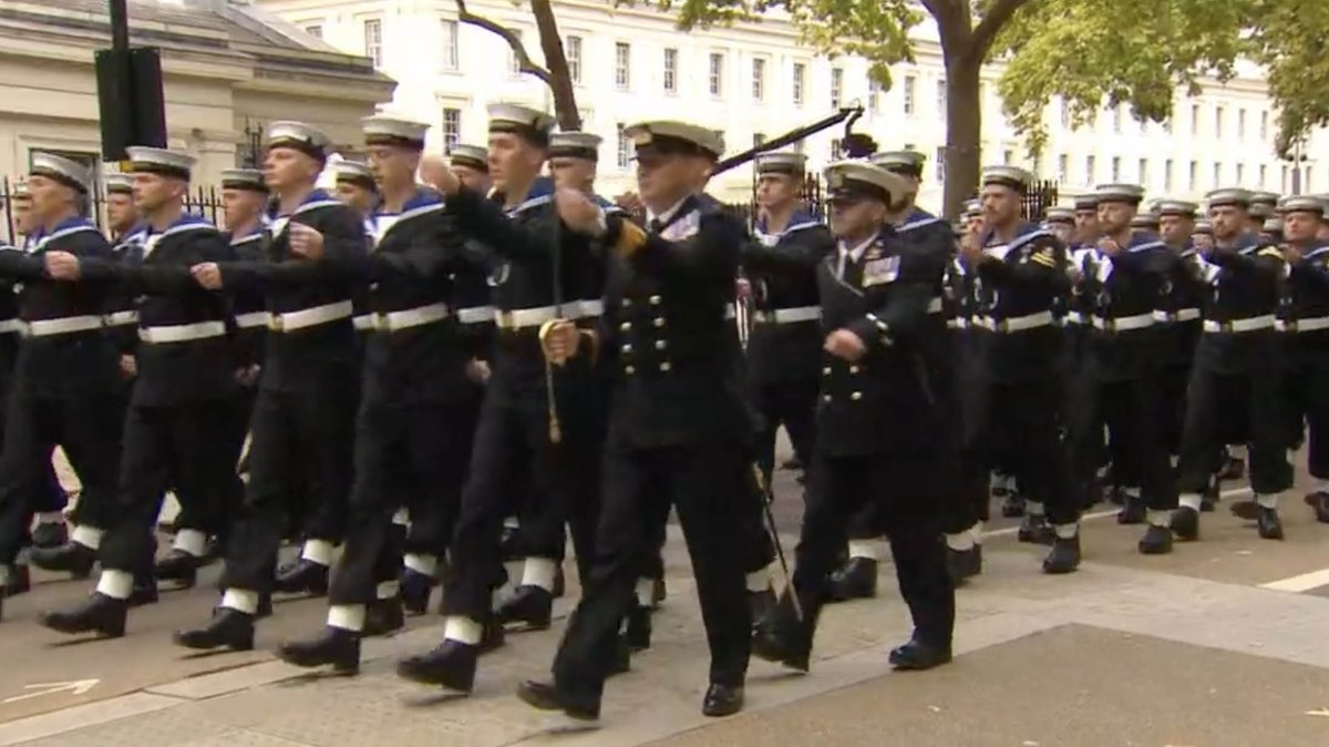NavyLookout's tweet photo. Naval personnel marching out of Wellington Barracks on their way to participate in the #queensfuneral https://t.co/110sMw9pF5