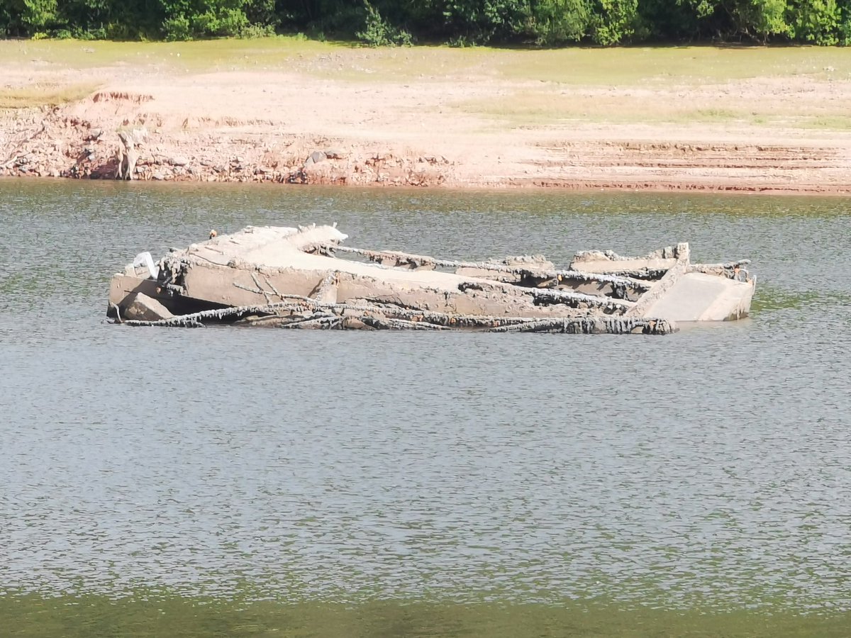 I wonder if anyone knows what this is in the bottom of Talybont Reservoir. Looks like a boat wreck