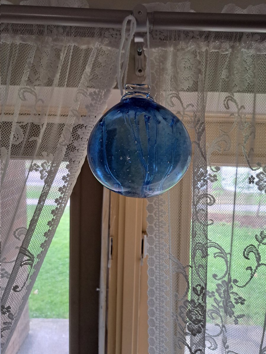 AbleistsSay's tweet photo. I've had this witch ball for decades. I finally have a place to hang it here in my new apartment and I'm thrilled. #witchball #witchy https://t.co/RBPVhwdrMZ