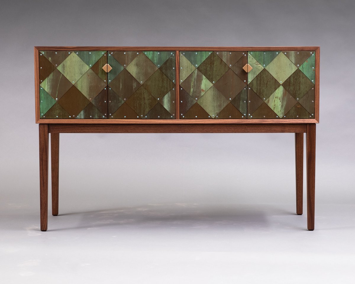 SolarFurniture's tweet photo. Just finished: a pair of these walnut cabinets with doors covered in patinated copper from the roof of the Parliament buildings.

The colours (and wear and tear) are as found on the raw material; nothing added but a clear coat.
52"L x 34"H https://t.co/Togxaqq3VQ
