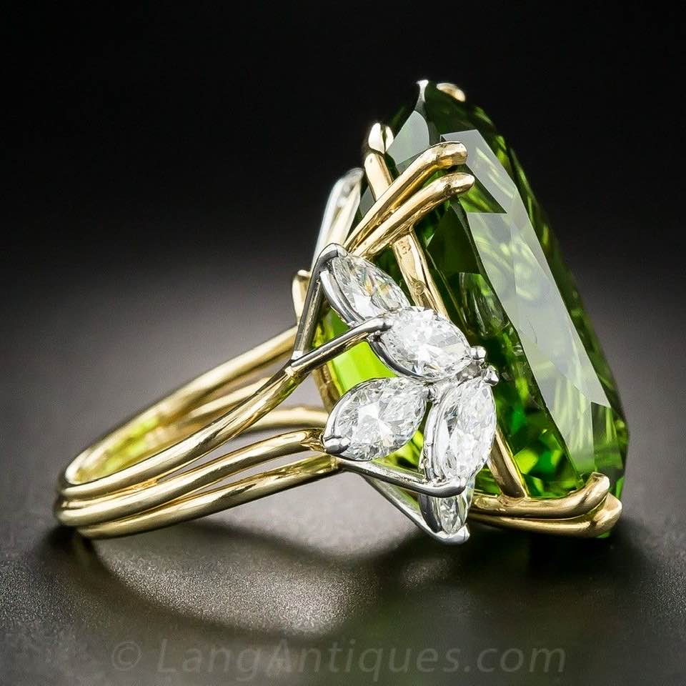 Peridot and diamond ring set in platinum. Vintage, mid 20th c. @LangAntiques