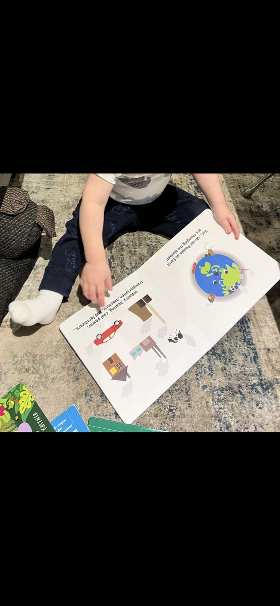 My 1-year old reading about climate change. Never too early to start, right? …. Right?? 🙃