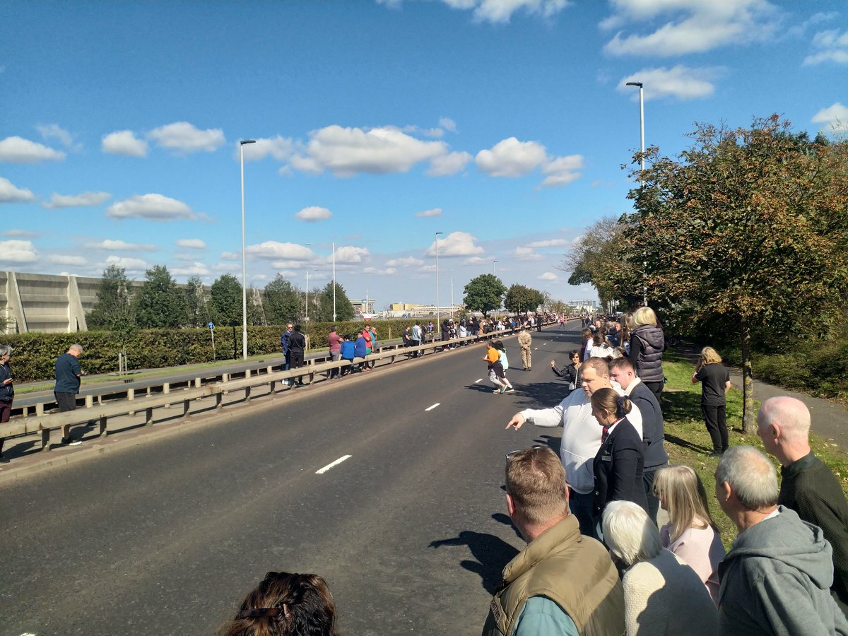 Waiting for the Queen to pass next to Heathrow. Big Before turn out.