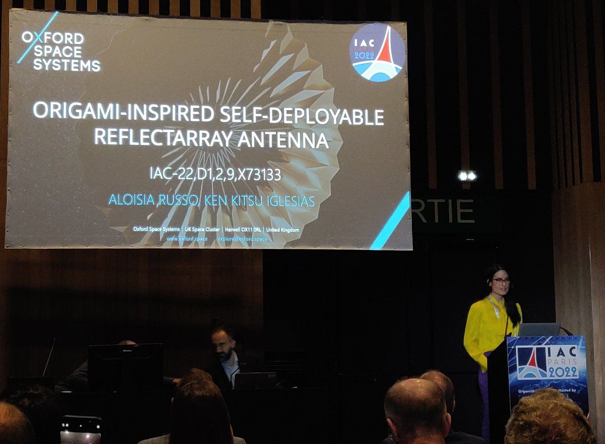 OxfordSpace's tweet photo. Our #Origami inspired deployable #ReflectArray development presented today @IACParis2022 by Aloisia Russo &amp; Ken Kitsu, both R&amp;D Engineers at @OxfordSpace and experts in origami! 
More to hear about our recent development on Wed. 21st at 2pm (IP session,screen 26). See you there! https://t.co/dRMizO36HK