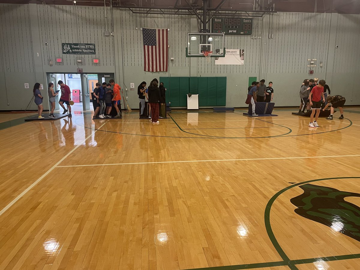 jamckoy1's tweet photo. Team Building week in PE and these scholars are working hard to make it across the gym with 1 fitness mat and 2 Polly circles! #eastcaryimps #ecms https://t.co/8NKG6Ke1Uq