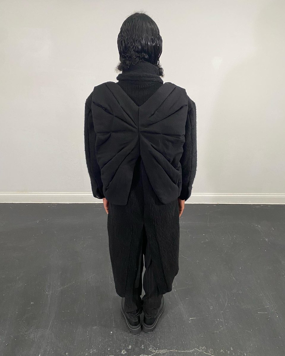 Denimani's tweet photo. These 2 pieces are a result of me experimenting with form and texture. The vest was inspired by tension between stretched materials. The body wrap can be worn multiple ways, maximizing utility and versatility within a simple silhouette. https://t.co/xHfSzm5etH
