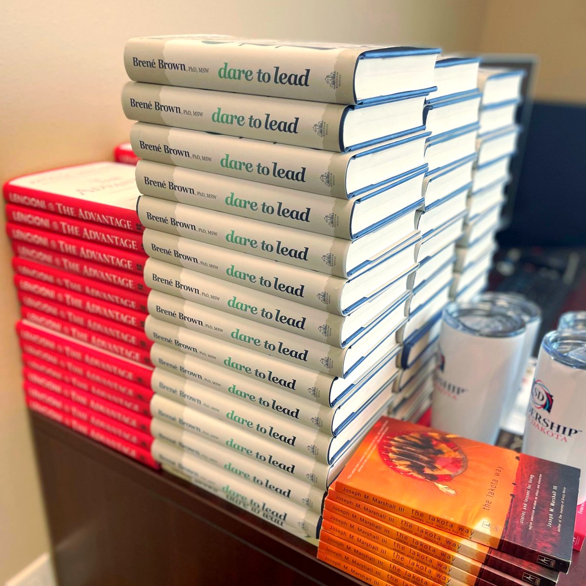 leadershipsodak's tweet photo. BTS (behind the scenes😉) with the Leadership SD team as we tackle final prep work to launch our 9th Class - the Class of 2023 - in just 2 DAYS! Big thanks to Val, Jacki, Molly, and Rick as they pull together all the last minute details and items 📚️ #MOREbooks #alltheboxes https://t.co/k6cVkG6Psj