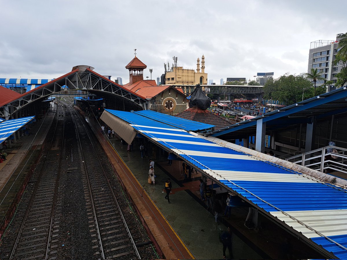 Pauliosum's tweet photo. Most days, the rains are a pain but sometimes the brick and the blue pop better against an overcast sky. https://t.co/mnHSANME3u