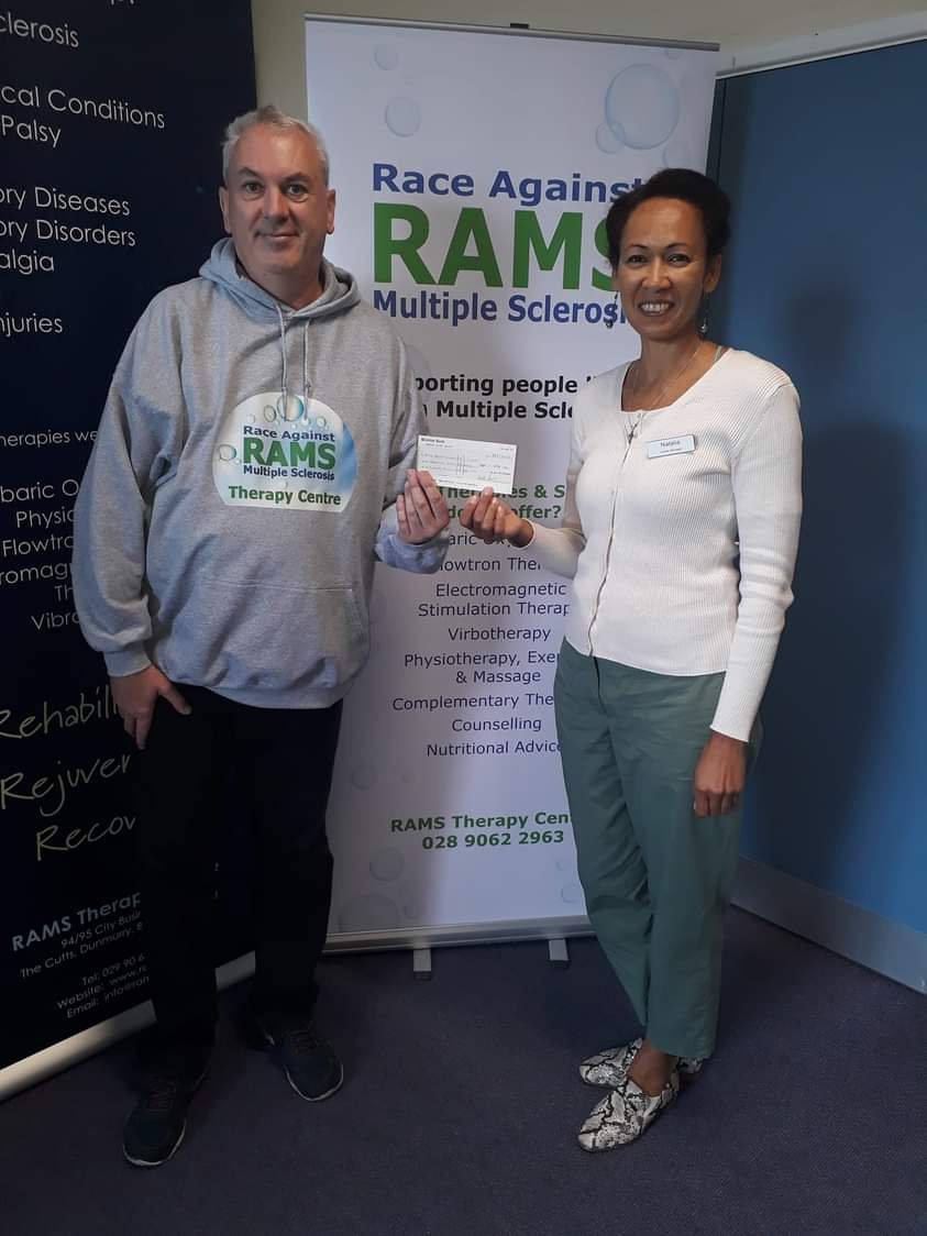 LongSclerosis's tweet photo. William Steenson . RAMS Therapy Centre Volunteer Fundraiser presents a cheque for £1,898.85 to RAMS Therapy Centre Manager Natalia Kennedy to help provide Oxygen Therapies Treatment for people living with Multiple Sclerosis in Northern Ireland . https://t.co/I93BQ3L8ye