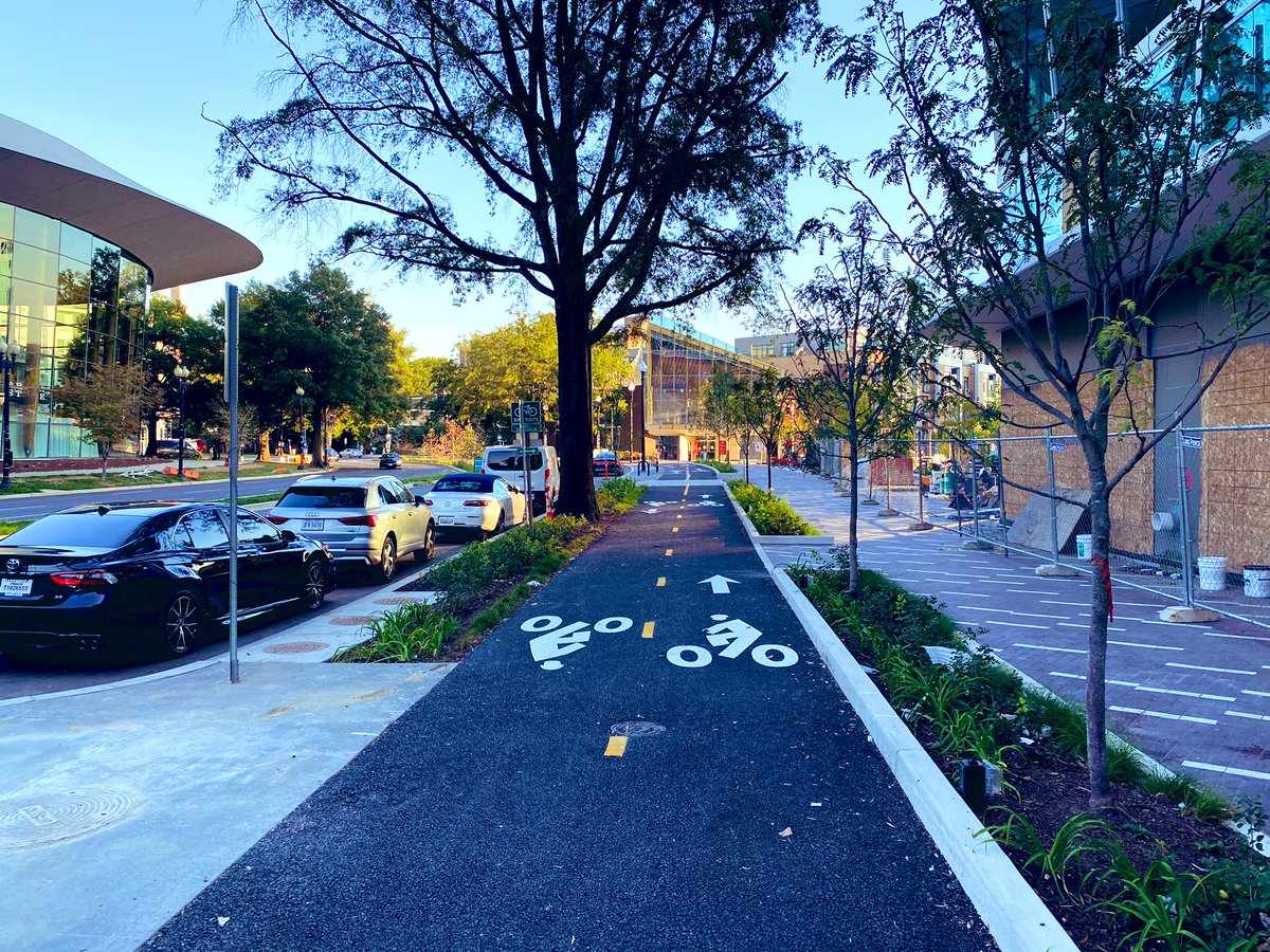 The cycle track and sidewalk along Maine Ave SW are now fully open along the full length of #TheWharfDC! #bikedc #walkdc