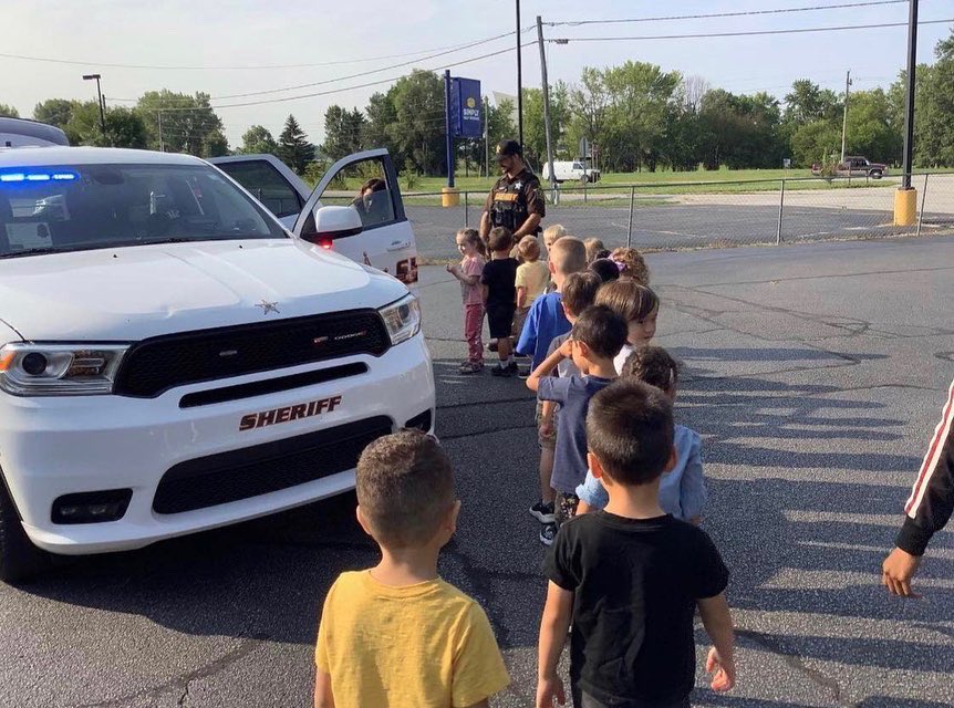 Deputy Ben North taking time to talk with youth at the Community Helpers Month event at Brookshire Learning in West Lafayette.