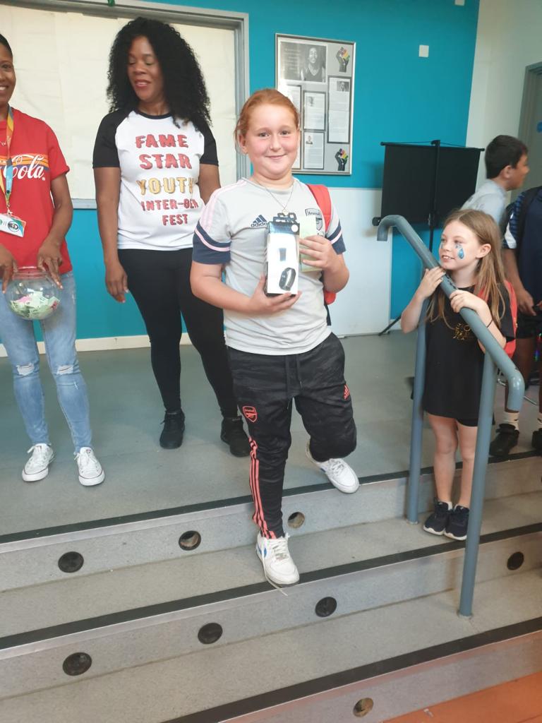 famestaryouth's tweet photo. @AFCCommunity #young #people serving the #elderly at #intergenfest & the luckiest person that won multiple raffle prizes. New #table M&S £50 #hamper and tickets to #Arsenal stadium tour. @NHGhousing @BerkeleyGroupUK @CommComm_UK @TNLComFund @mayorofhackney @younghackney https://t.co/yhJ4LyVDlE