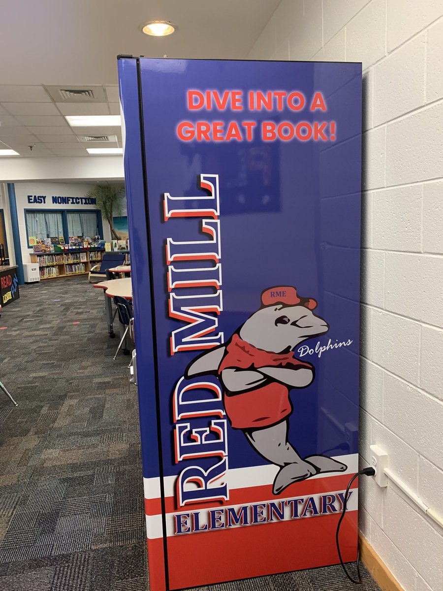 RedmillLMC's tweet photo. Our Dolphins love their new book vending machine! Who needs sodas and snacks from a vending machine when you can have books? @RMESPrincipal @RedMill_AP https://t.co/xXGPi5hJ2Z