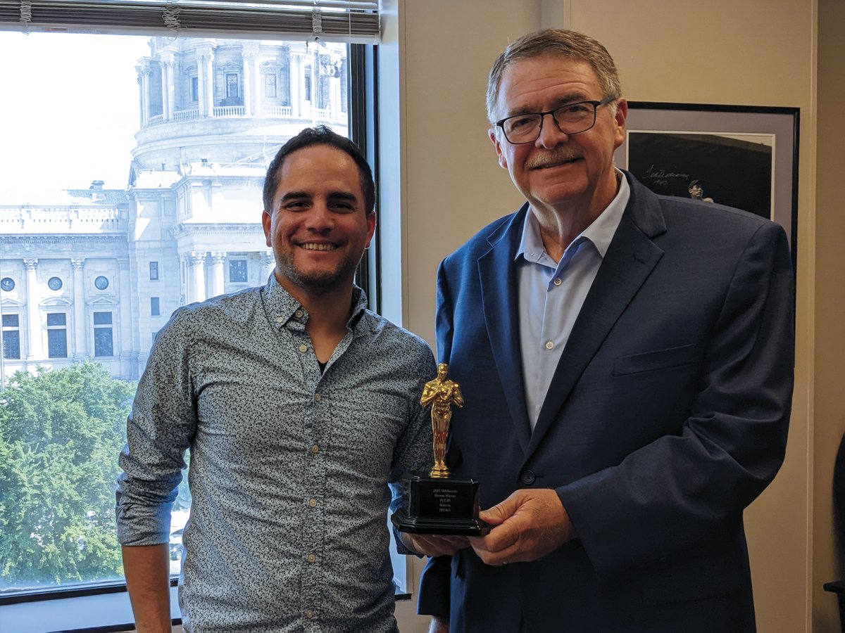 TeamPPOS's tweet photo. Our Associate Creative Director, Carlos Centeno, and Curt Schroder, Executive Director of @paciviljustice take a moment to savor sweet victory. The elegant and user-friendly website we created them won a Bronze Award in the national Service Industry Advertising Awards. #SIAAward https://t.co/uNvuXqPnMC