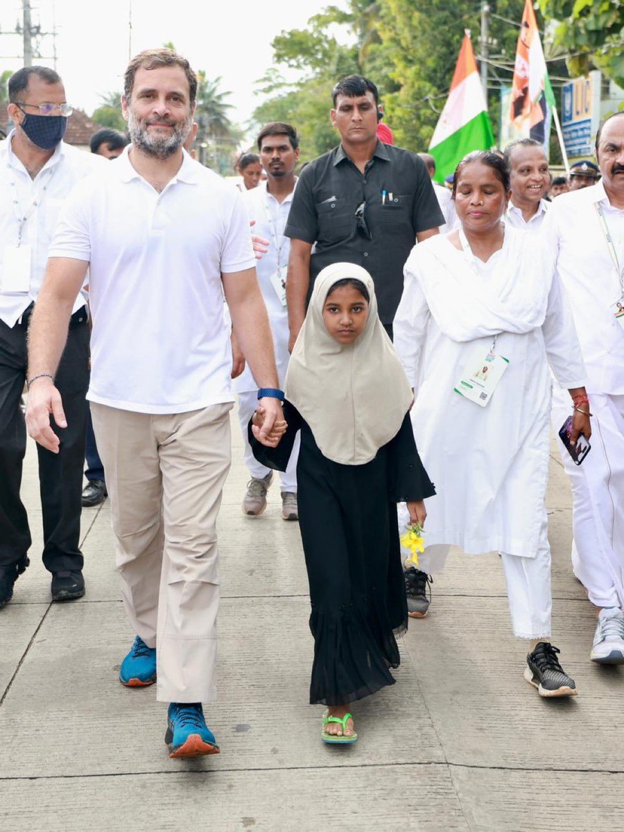 ashoswai's tweet photo. How many political leaders in India, when the country is under the spell of majoritarianism, can walk hand in hand with a hijab-wearing girl? #BharatJodoYatra https://t.co/G9maIDC7qD