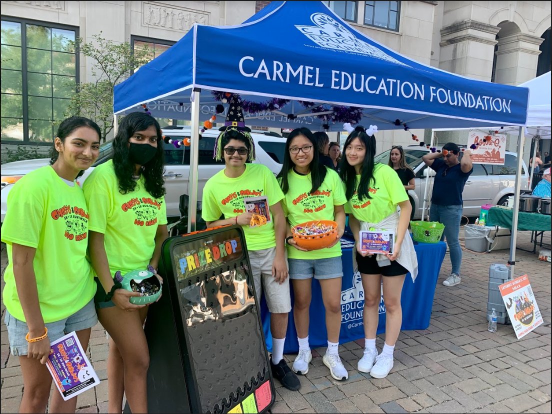 Thank you to the Carmel High School National Honor Society students for helping promote our 14th Annual Ghosts and Goblins Race Saturday at the Carmel Farmer's Market.  We had an awesome time, the weather was perfect, and PLINKO was a hit!  Thank You NHS. <a href="/myccs/">Carmel Clay Schools</a>