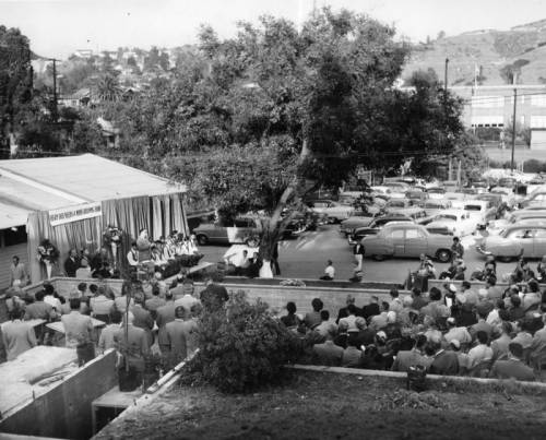 The next #HighlandParkPhoto… Caption dated November 20, 1953 reads, 'Phil D. McHugh, emcee, stands at microphone during ceremonies at new Optimist Home for Boys, attended by scores of Optimist Club members and civic officials...' #LAPLPhotos #HighlandPark