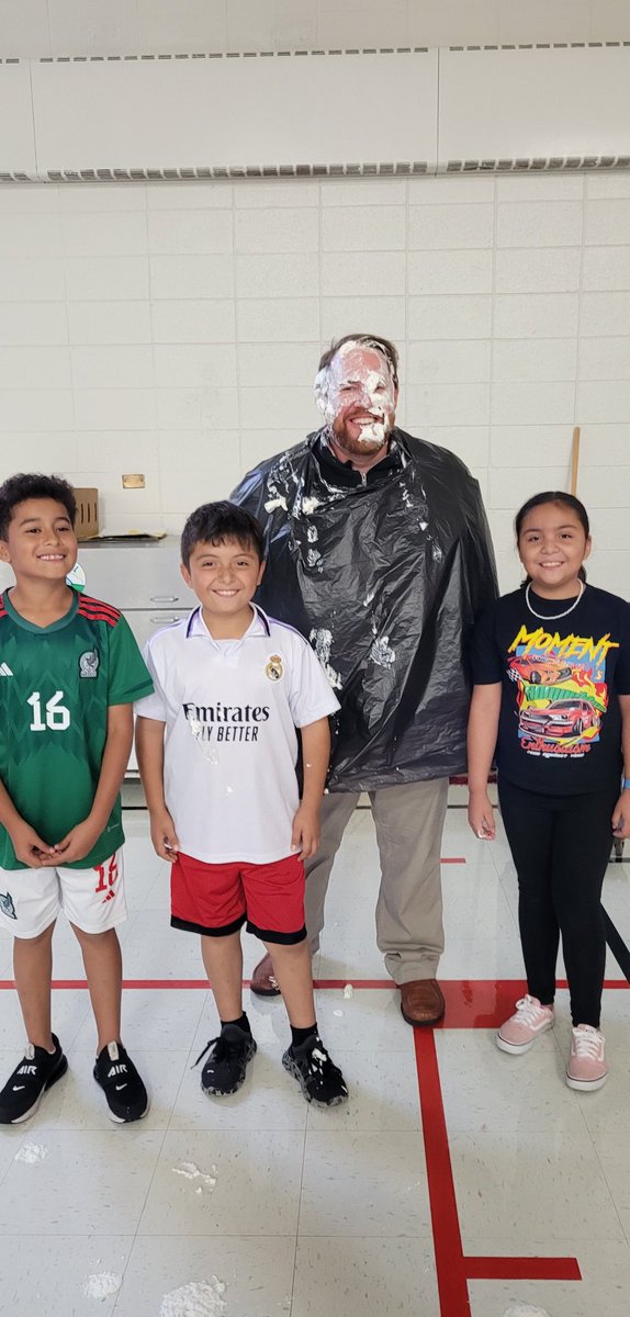 Long over due Coin War winner's from last year Ms. Romero's 2nd grade class pie the principal Mr. Tucker today during lunch period.