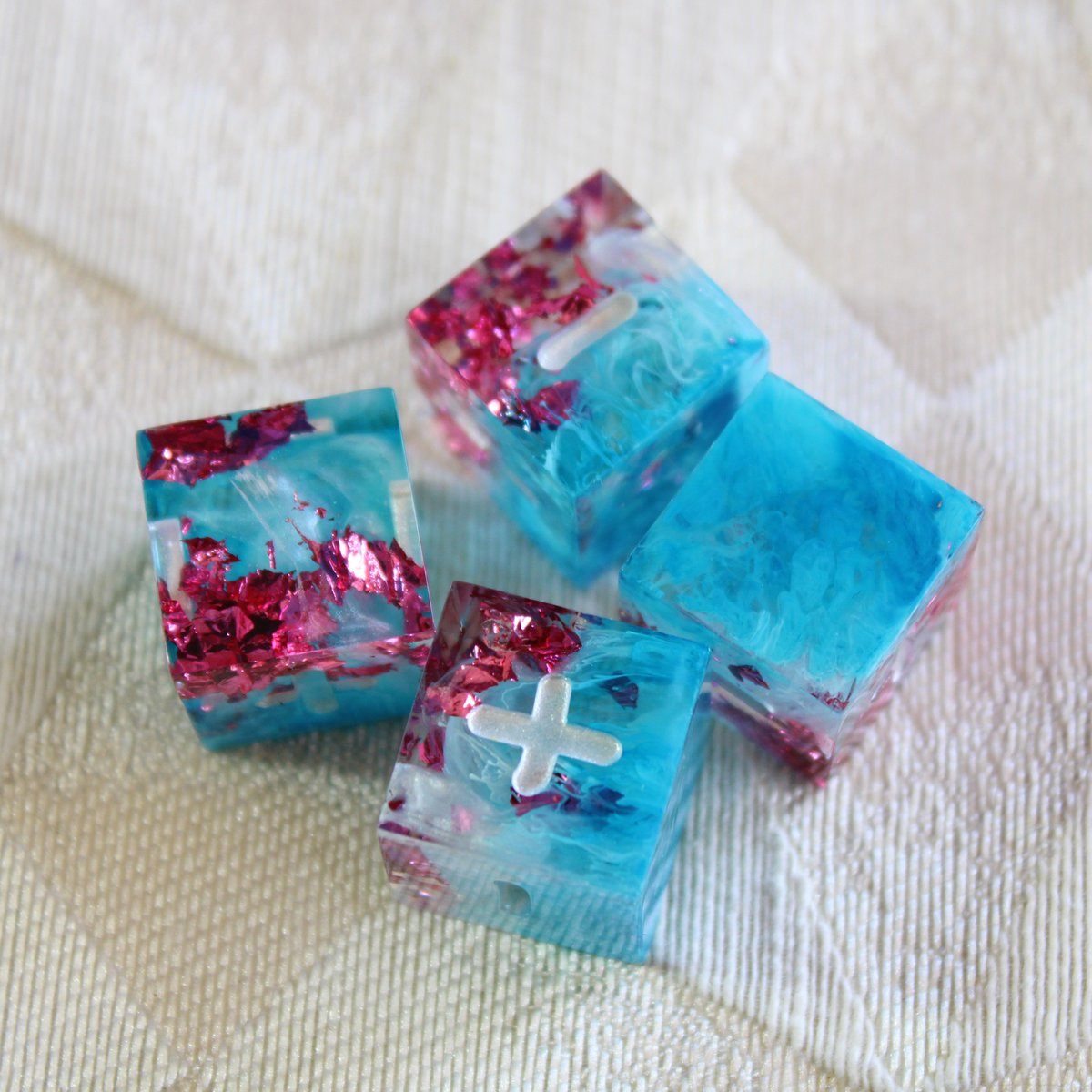 alchemist_attic's tweet photo. I don't make as many, but alongside the polyhedral dice I also make fudge dice! (or fate dice. Whatever you want to call them.)
Here's the set that was added in the last shop restock. They remind me of cherry blossoms :)
#handmadedice #dice #fatedice #fudgedice #resinart #resin https://t.co/0zw3L7OHjG