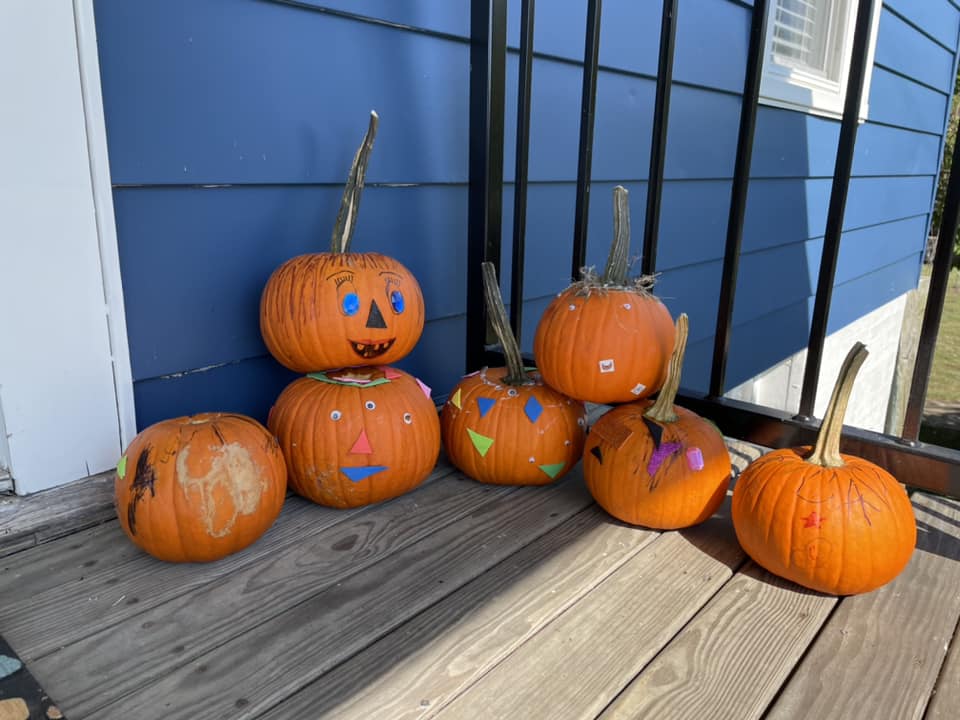Children got to decorate free pumpkins from the Library’s booth at the Midway Fall Festival this past weekend. We gave away 725 pumpkins to kids, courtesy of the Midway Business Association. The abandoned pumpkins have found a new home on the porch of Midway City Hall.