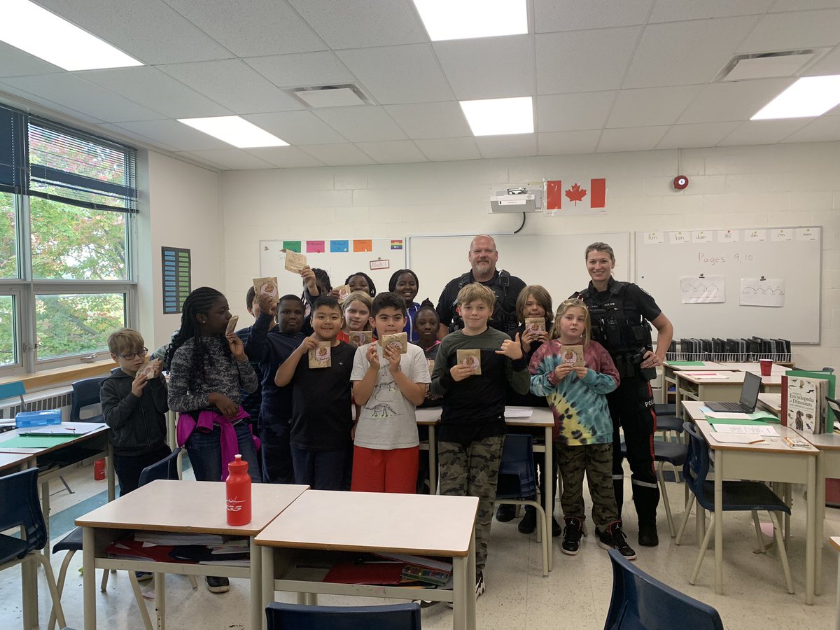 AssumptionOCSB's tweet photo. Big thanks to Sergeant Cleroux &amp; the Neighbourhood Resource team for @TimHortons Smile Cookies for Gr 5 &amp; 6 students. There was definitely #ocsbJoy with cookies, special guests and learning Sergeant Cleroux attended @AssumptionOCSB as a student! @OttawaPolice #ocsbBeCommunity https://t.co/uYlIgYijeq