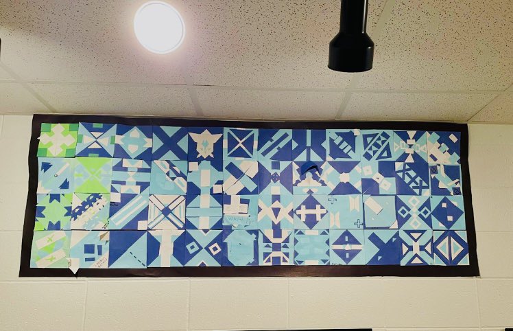Mrs. Humphrey’s 5th and 6th grade art students created a large quilt mural made of individually designed symmetrical blocks.