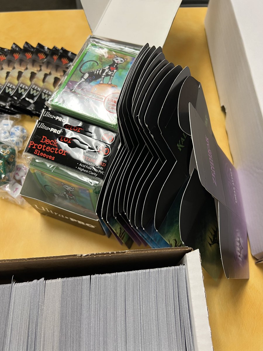 comics_teacher's tweet photo. The Oak Lawn High Game Club’s @magikidsMTG kit came today, and it is awesome!

Our students, new to the game, have more resources now, and with the game as expensive as it is…it’s MUCH appreciated. 

Go check them out and consider donating! https://t.co/iO22vkZLe5
