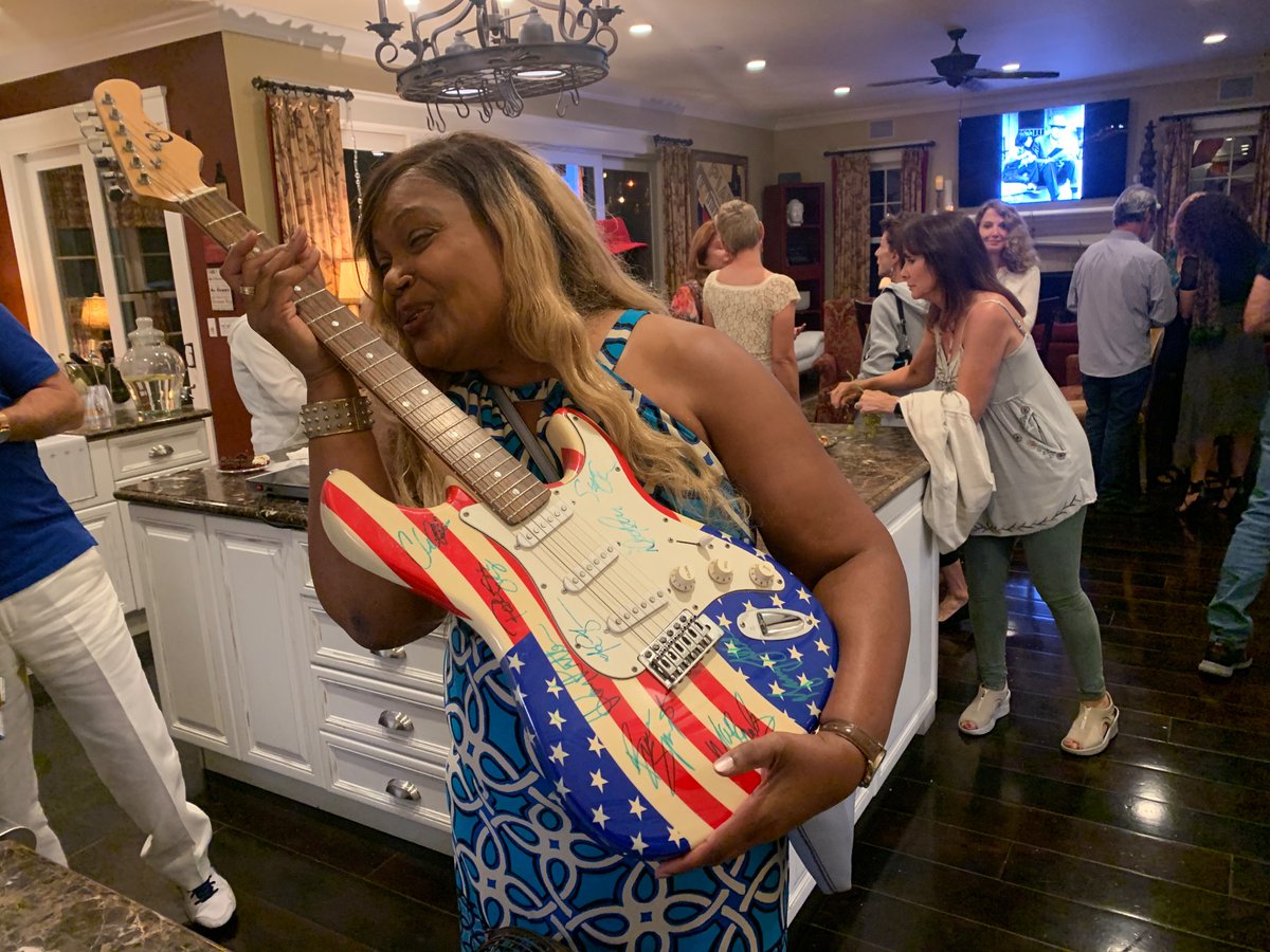 CKelleyLive's tweet photo. Happiness is being invited to the home of friends for a party to meet former presidential candidate Marianne Williamson and running into Bruce Springsteen’s autographed guitar, too. #ilovela #mariannewilliamson #brucespringsteenandtheestreetband #NationalVoterRegistrationDay https://t.co/Kvx5YBclb2