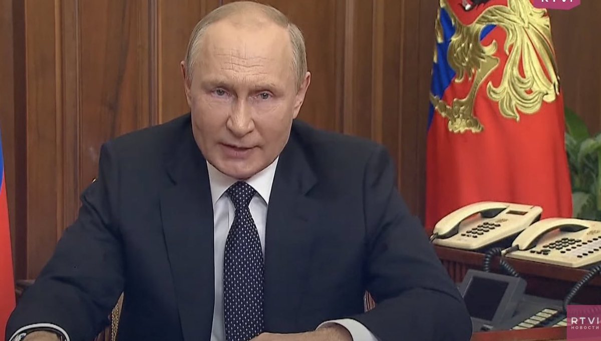 Vladimir Putin, threatening the world and claiming to have the most high tech military, next to his fax machine and two landlines.