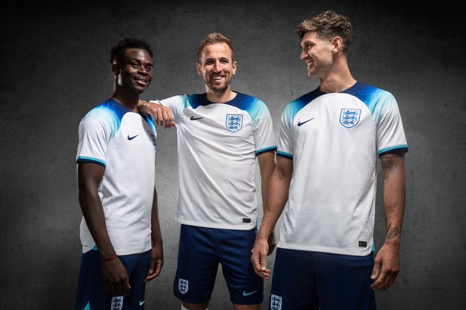 Bukayo Saka, Harry Kane and John Stones wearing the new England men's kit.