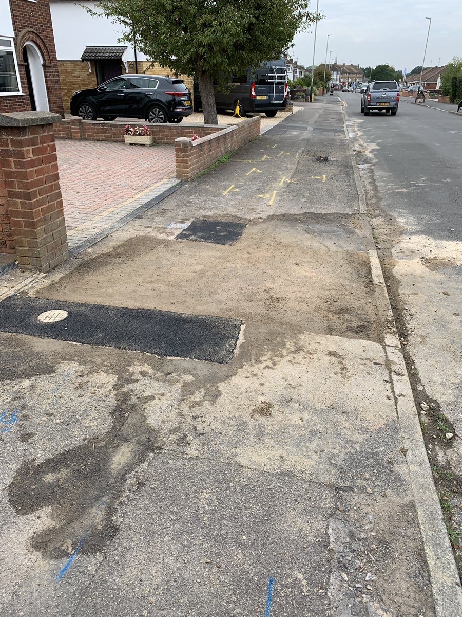 gavinjerman's tweet photo. @stwater the team that filled in the holes after your repair have left a right old mess of the pavement (I’ve cleared the mess on my drive). Will you get someone to clean it up and collect your barriers and signs that are partially blocking my entrance. ASAP please, thanks. https://t.co/9tx1UHXYIz