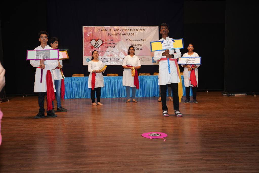 ActvBleedCntrol's tweet photo. High school students performing stop the bleed awareness skit on 4th Annual summit ABC-Active Bleeding Control
Thank you students 
for becoming ABC gurus to save road injury victims.
@VinayMNadkarni @GeethanjaliRam5 @drpuppalaa @ChildrensPhila @upiasi @PediSTARSIndia @IDF_INDIA https://t.co/RVzRCiIKQn