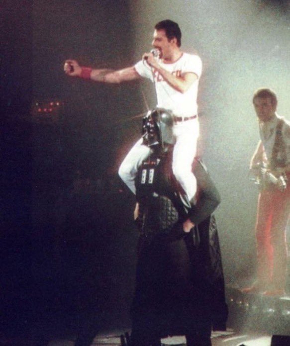 Freddy Mercury gets a piggyback from Darth Vader (1980)