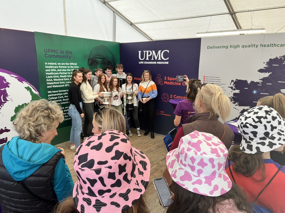 UPMCinIreland's tweet photo. Grace Walsh and Mary O’Connell from Kilkenny’s Senior Camogie team have joined us today @NPAIE #Ploughing2022 with the O’Duffy Cup. #KilkennyChampions https://t.co/9MS1rxCsX3