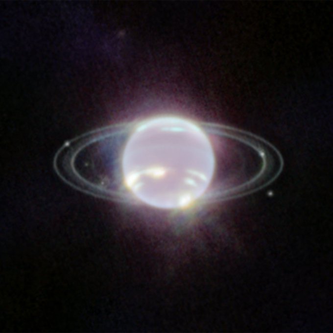 Descripción: Los anillos de Neptuno son claramente visibles en esta imagen de Webb. Sobre un fondo oscuro, el planeta se asemeja a una perla con etéreos óvalos concéntricos a su alrededor.