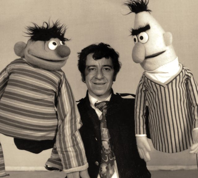Photographer David Attie poses with Ernie and Bert.