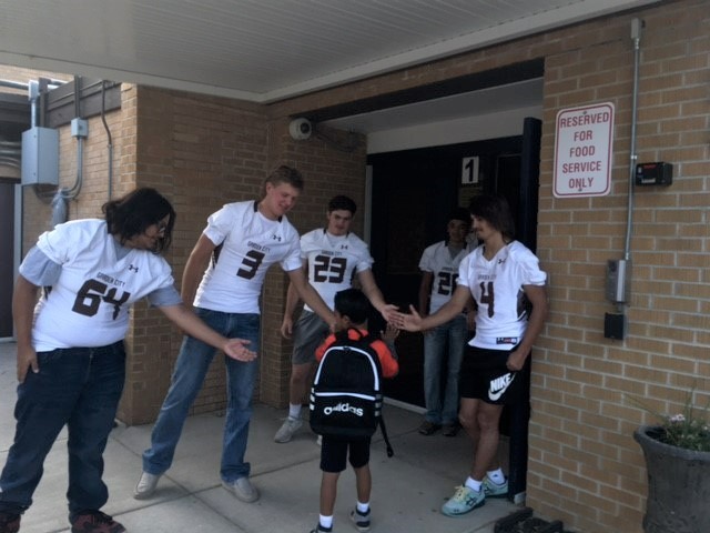 USD457's tweet photo. The GCHS Football players were at Plymell Elementary School this morning greeting students and giving high-fives. The team will play at home on Friday. Come out and support the them on their winning season. https://t.co/lEeT6TzyET