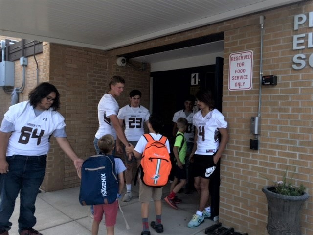 USD457's tweet photo. The GCHS Football players were at Plymell Elementary School this morning greeting students and giving high-fives. The team will play at home on Friday. Come out and support the them on their winning season. https://t.co/lEeT6TzyET