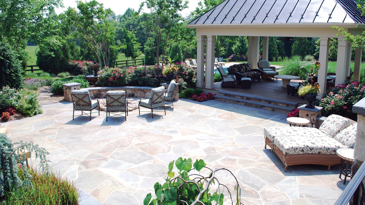 Kane Landscapes, Inc. conjures a blooming, multifaceted landscape in Leesburg, Virginia. The project included a pool and patio installation, masonry walls and walks, a pool pavilion and a sport court. Plantings include cryptomeria, cherry and crab apple trees and crape myrtles.