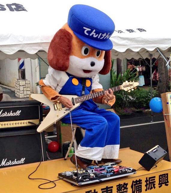 mondomascots's tweet photo. Tenken-kun, a guitar-strumming dog mechanic, is the car maintanance mascot for Japan’s Kansai region. https://t.co/ss9U8Z79oA