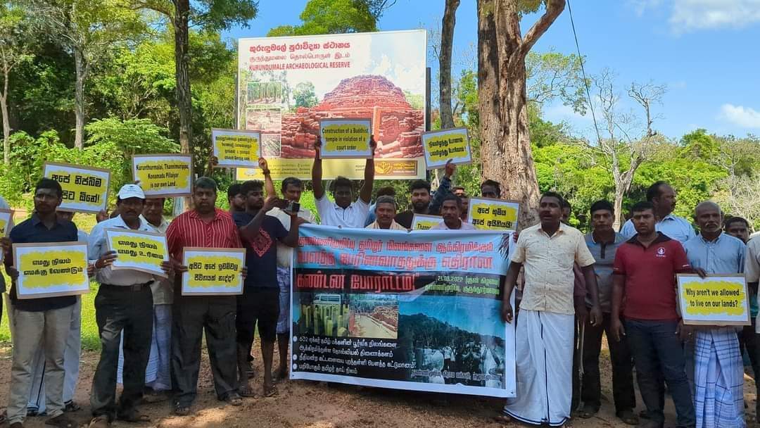 kavinthans's tweet photo. Former Northern Councillor T. Ravikaran and activist R. Mayoorn, who staged a protest in Kurunthoor-malai today against the land grab and the ongoing construction despite court order, have been arrested when both of them went to the police after being  summoned.

#SriLanka https://t.co/IRuaFhma2t