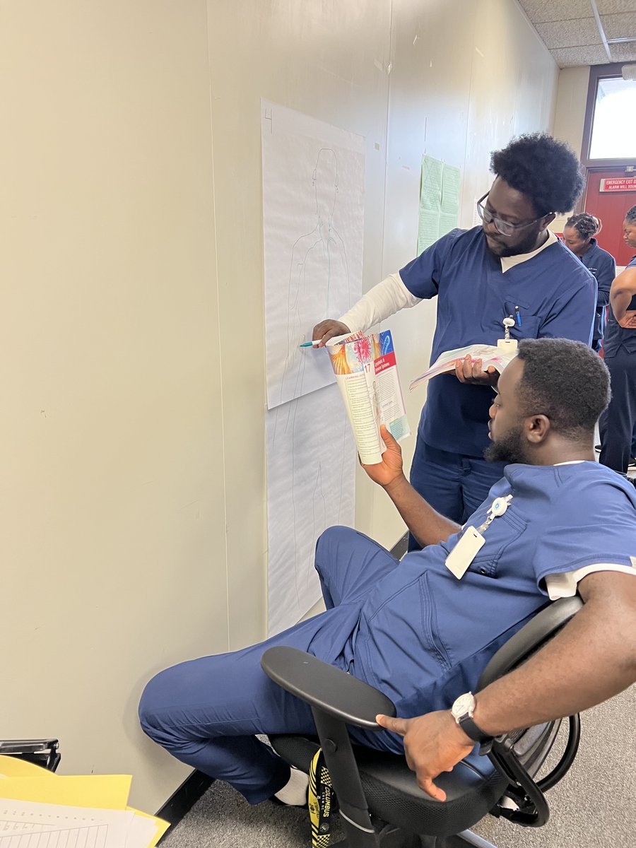 columbusadulted's tweet photo. 💙💚 Practical Nursing students test their drawing skills while in Joy Rockhold’s human anatomy and physiology class. We LOVE to see our students working together!  #ACEimprovesLives #nursingschool #lpnprogram @ColsCitySchools https://t.co/TggnJKXiYP