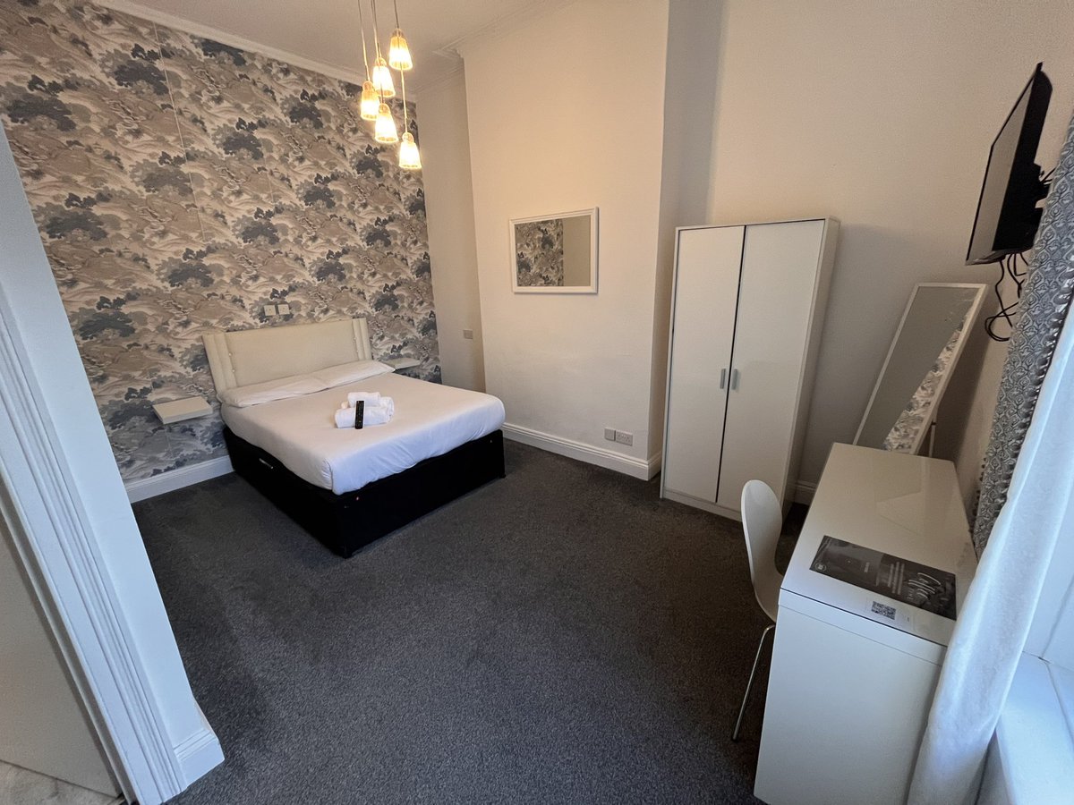 Mount Rooms Hotel, Barry Island, Wales.
Plug by bed, free wifi, good shower, no biscuits.